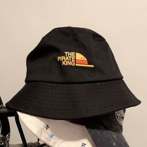 Black Bucket Hat with Yellow One Piece "King Of The Pirates"